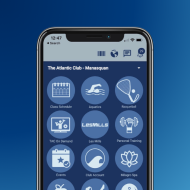 A smartphone screen displaying a fitness club app with icons for classes, aquatics, racquetball, and more on a blue background.